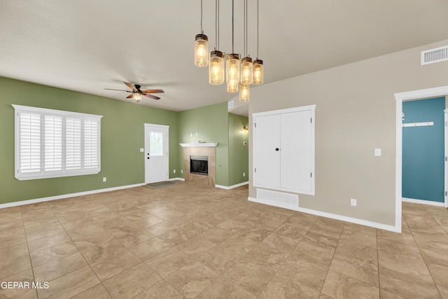 2937 Pino Triste Dr, El Paso, TX 79938 - unfurnished living room with ceiling fan, a fireplace, and light tile patterned flooring