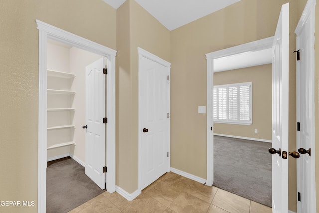 2937 Pino Triste Dr, El Paso, TX 79938 - corridor with carpet flooring and tile patterned floors