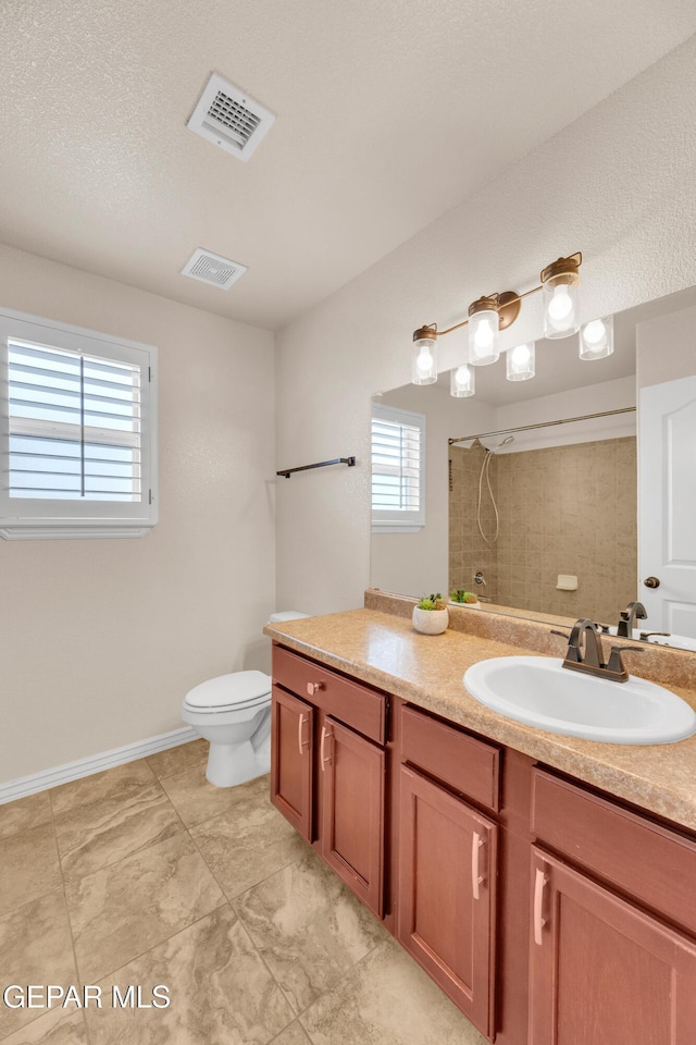 2937 Pino Triste Dr, El Paso, TX 79938 - full bathroom with vanity and tiled shower