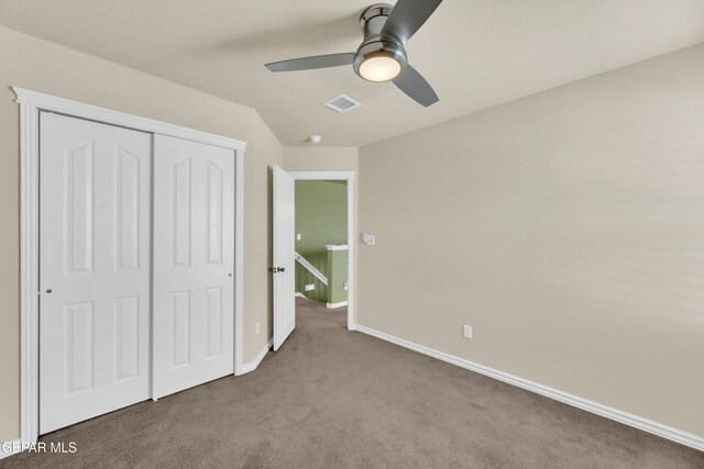 2937 Pino Triste Dr, El Paso, TX 79938 - unfurnished bedroom with carpet flooring, a closet, and a ceiling fan