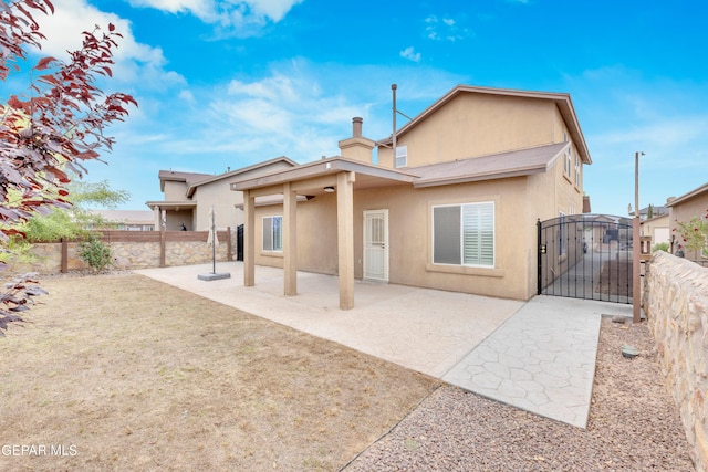 2937 Pino Triste Dr, El Paso, TX 79938 - rear view of property featuring stucco siding, a gate, ceiling fan, and a patio