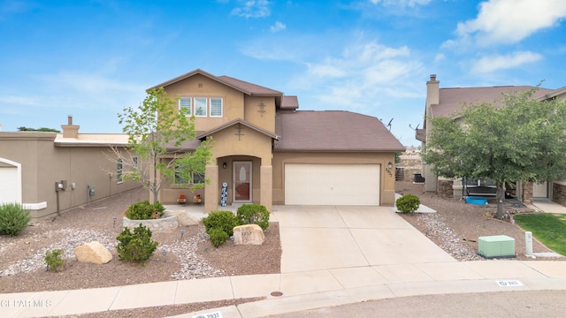 2937 Pino Triste Dr, El Paso, TX 79938 - view of front facade featuring stucco siding, a garage, and driveway