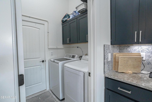 13820 Paseo De Loma Ct, Horizon City, TX 79928 - laundry room with cabinet space and washer and clothes dryer