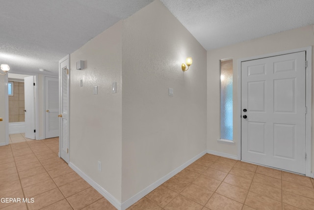 7308 Cerro Negro Dr, El Paso, TX 79912 - foyer with a textured ceiling and light tile patterned flooring