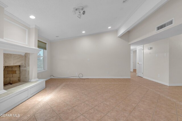 7308 Cerro Negro Dr, El Paso, TX 79912 - unfurnished living room featuring recessed lighting, light tile patterned floors, crown molding, and a fireplace