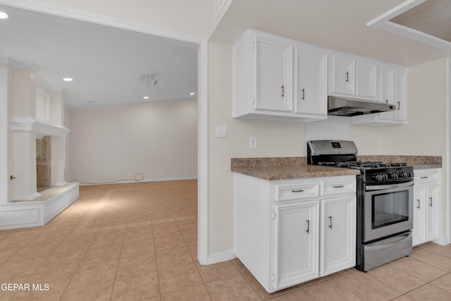 7308 Cerro Negro Dr, El Paso, TX 79912 - kitchen featuring gas range, under cabinet range hood, white cabinetry, light tile patterned floors, and recessed lighting