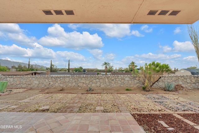 7308 Cerro Negro Dr, El Paso, TX 79912 - fenced backyard with a patio area and a mountain view