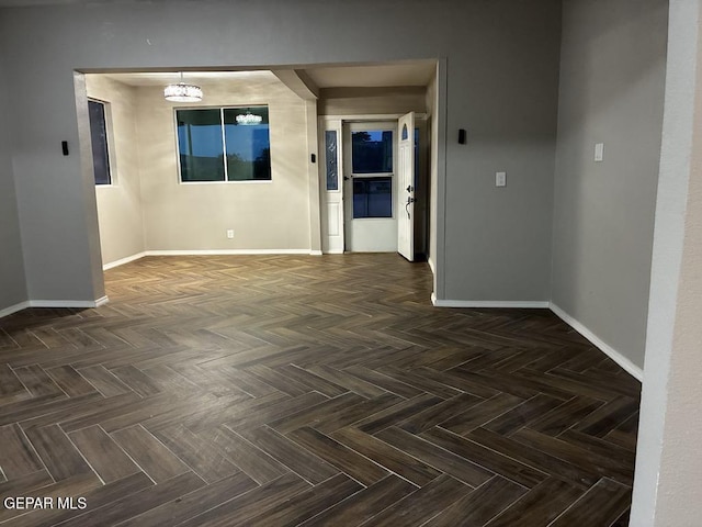 5789 Mountain Sun Dr, El Paso, TX 79938 - spare room featuring baseboards and a chandelier