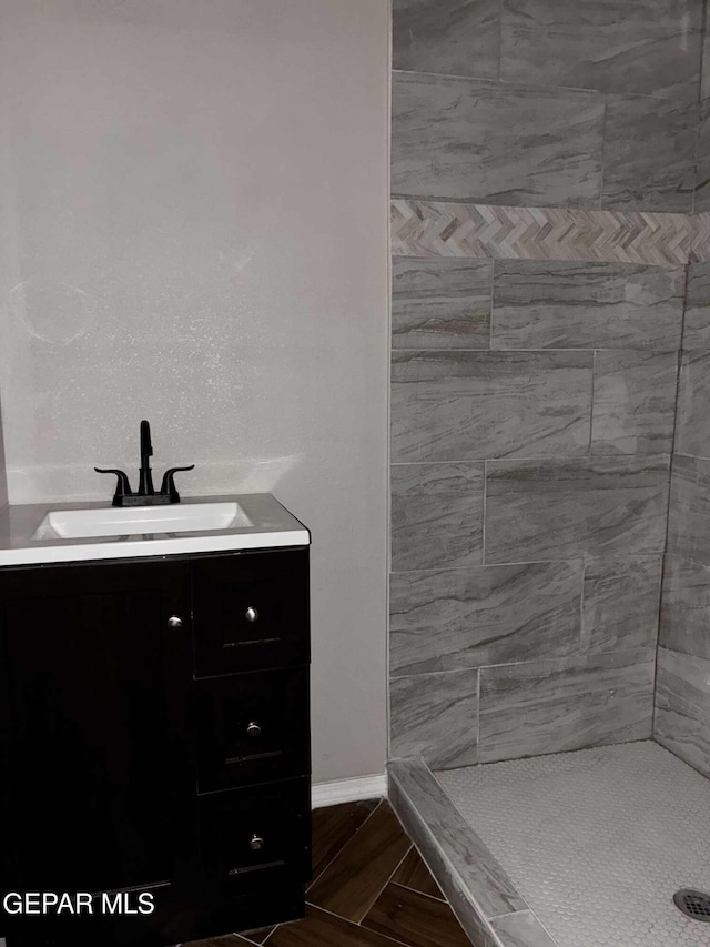 5789 Mountain Sun Dr, El Paso, TX 79938 - bathroom with a tile shower and vanity