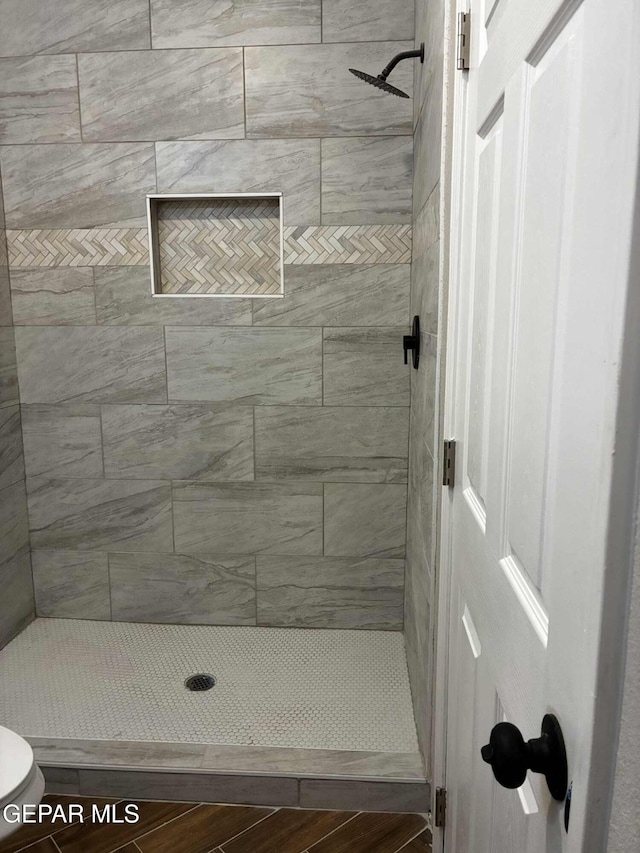 5789 Mountain Sun Dr, El Paso, TX 79938 - bathroom featuring tiled shower and toilet