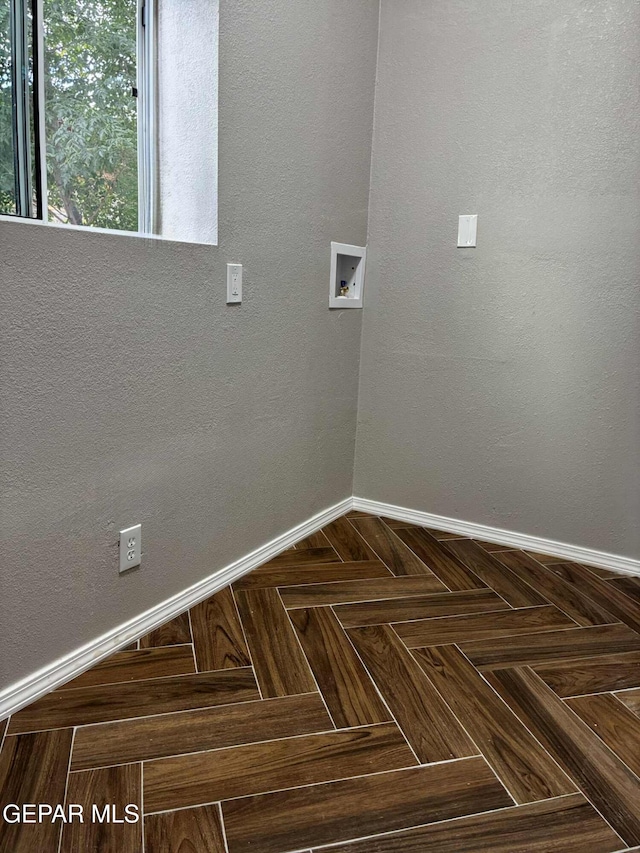 5789 Mountain Sun Dr, El Paso, TX 79938 - laundry room featuring washer hookup and baseboards