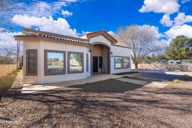 10728 Regina Dr, Socorro, TX 79927 - view of front of home featuring stucco siding and a tiled roof