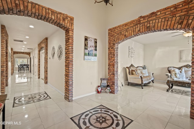10728 Regina Dr, Socorro, TX 79927 - hall featuring arched walkways, recessed lighting, and light tile patterned floors