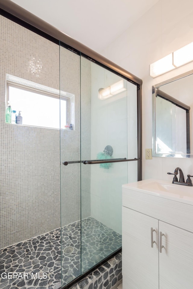 10728 Regina Dr, Socorro, TX 79927 - full bath featuring a shower stall and vanity