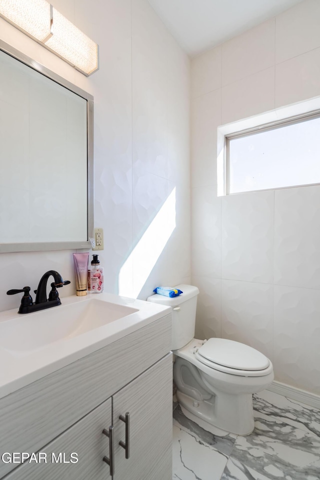 10728 Regina Dr, Socorro, TX 79927 - half bath featuring vanity and marble look tiles