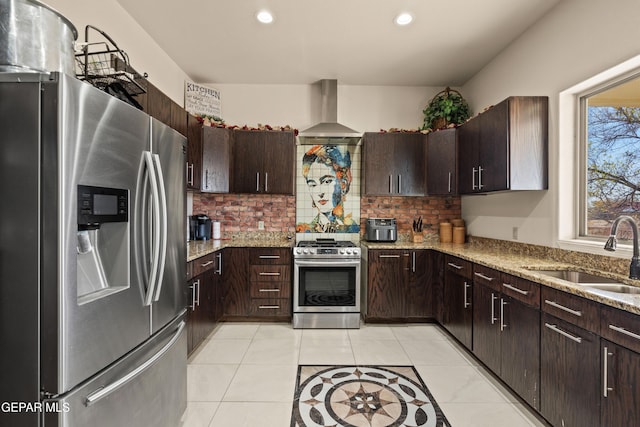 10728 Regina Dr, Socorro, TX 79927 - kitchen with appliances with stainless steel finishes, range hood, decorative backsplash, recessed lighting, and light stone countertops