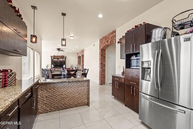 10728 Regina Dr, Socorro, TX 79927 - kitchen featuring stainless steel appliances, open floor plan, dark brown cabinets, ceiling fan, and recessed lighting
