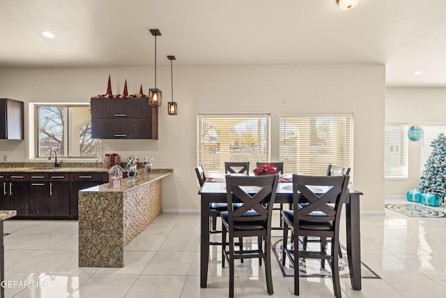 10728 Regina Dr, Socorro, TX 79927 - dining area with light tile patterned floors and recessed lighting