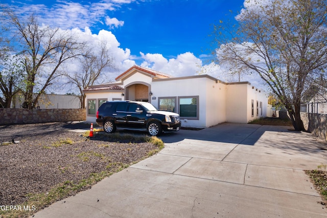 10728 Regina Dr, Socorro, TX 79927 - mediterranean / spanish-style home with stucco siding, a tiled roof, and driveway