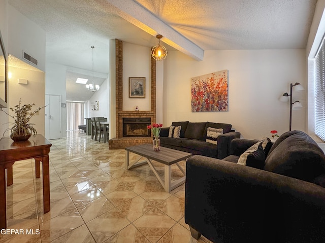 11359 Lake Loy Dr Unit A, El Paso, TX 79936 - living area featuring a textured ceiling, a chandelier, light marble finish floors, and a brick fireplace