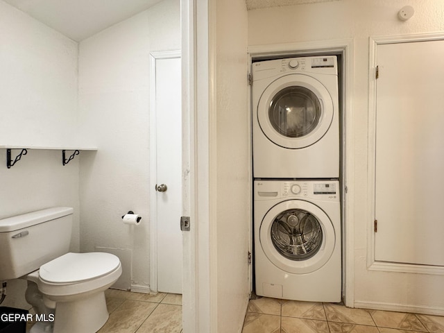 11359 Lake Loy Dr Unit A, El Paso, TX 79936 - laundry area featuring stacked washer / dryer and light tile patterned floors