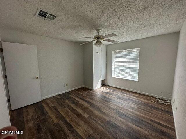 2129 Noviembre Dr, El Paso, TX 79935 - empty room featuring wood finished floors, ceiling fan, and a textured ceiling