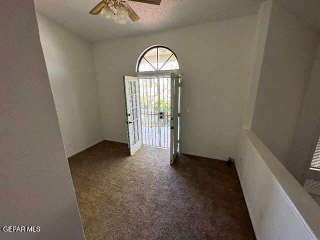 2129 Noviembre Dr, El Paso, TX 79935 - carpeted entryway featuring ceiling fan