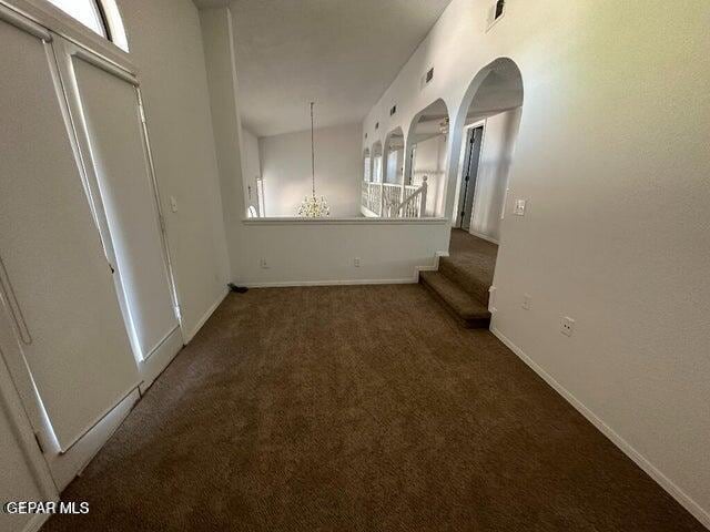 2129 Noviembre Dr, El Paso, TX 79935 - carpeted empty room with baseboards and arched walkways