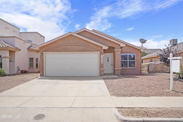 12920 Tierra Salas Dr, El Paso, TX 79938 - view of front facade featuring a garage, driveway, and stucco siding