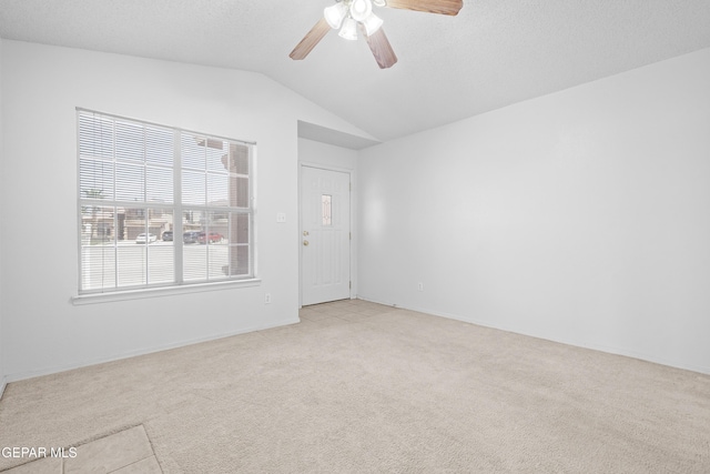 12920 Tierra Salas Dr, El Paso, TX 79938 - unfurnished room featuring light colored carpet, vaulted ceiling, and ceiling fan