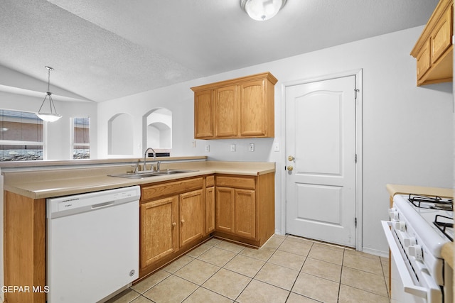 12920 Tierra Salas Dr, El Paso, TX 79938 - kitchen with white appliances, light countertops, a textured ceiling, a peninsula, and light tile patterned floors