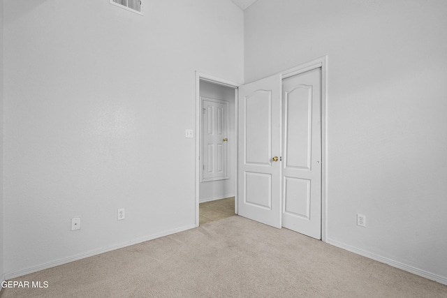 12920 Tierra Salas Dr, El Paso, TX 79938 - unfurnished bedroom with carpet flooring, a towering ceiling, and a closet