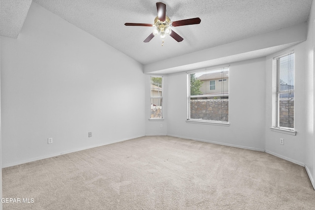 12920 Tierra Salas Dr, El Paso, TX 79938 - carpeted empty room featuring a textured ceiling, a ceiling fan, and vaulted ceiling