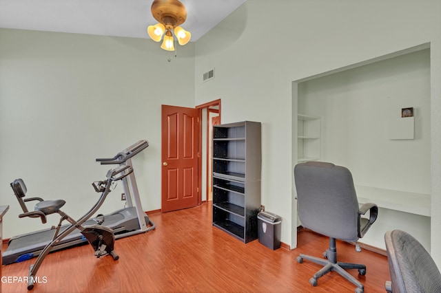 12249 Holy Springs Ct, El Paso, TX 79928 - office space with wood finished floors, a ceiling fan, and a high ceiling