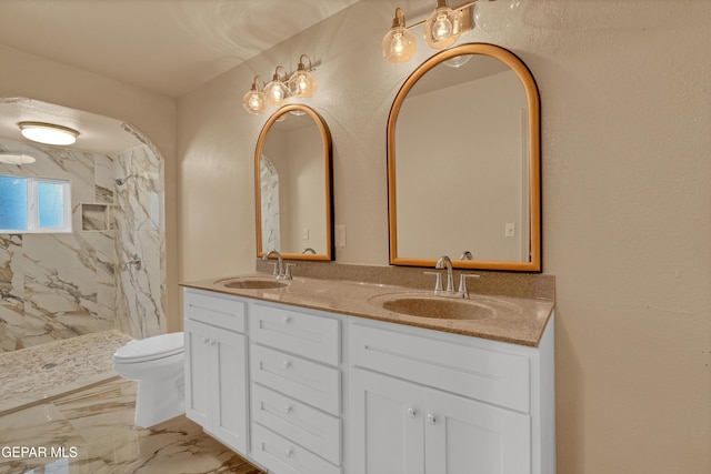 12249 Holy Springs Ct, El Paso, TX 79928 - full bath featuring double vanity, a marble finish shower, and marble finish floors