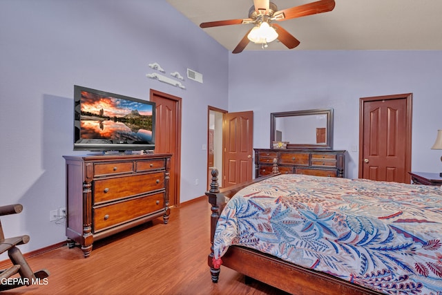 12249 Holy Springs Ct, El Paso, TX 79928 - bedroom with wood finished floors, a towering ceiling, and a ceiling fan
