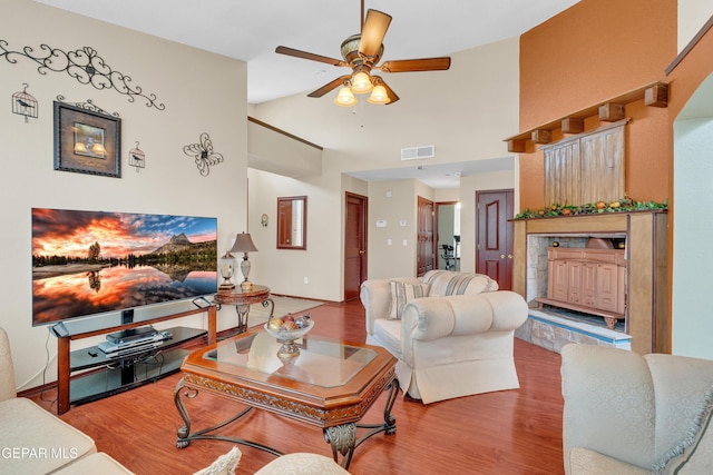 12249 Holy Springs Ct, El Paso, TX 79928 - living room featuring a ceiling fan, wood finished floors, and high vaulted ceiling
