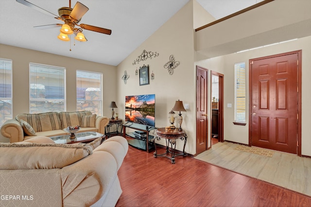 12249 Holy Springs Ct, El Paso, TX 79928 - living area with wood finished floors, ceiling fan, and high vaulted ceiling