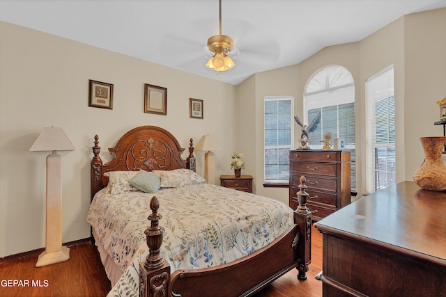 12249 Holy Springs Ct, El Paso, TX 79928 - bedroom with wood finished floors, multiple windows, vaulted ceiling, and ceiling fan