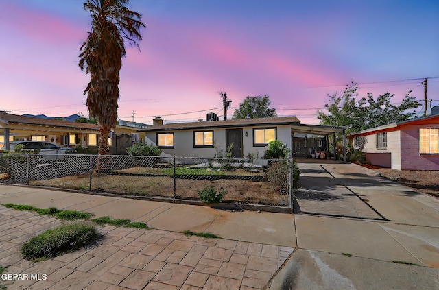 4437 Skyline Ave, El Paso, TX 79904 - ranch-style home featuring driveway, a fenced front yard, and a carport