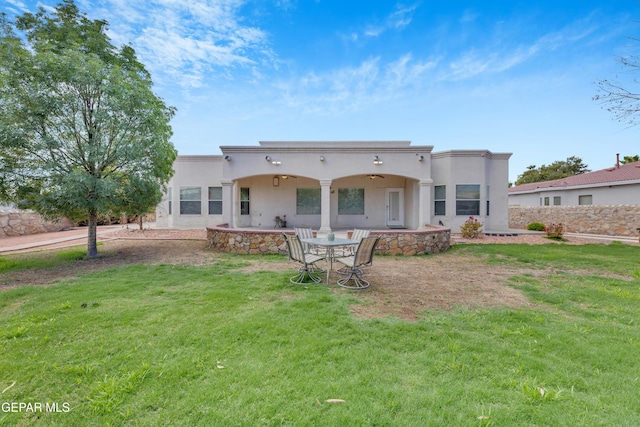 787 Maxey Marie Dr, El Paso, TX 79932 - back of property featuring a patio, a lawn, and stucco siding