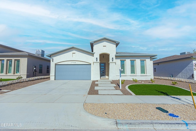 1798 Dana Gray St, El Paso, TX 79928 - view of front of house with a garage, driveway, and stucco siding