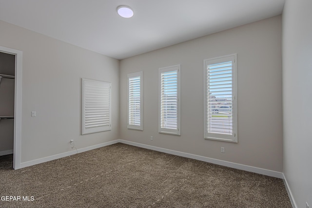 1798 Dana Gray St, El Paso, TX 79928 - unfurnished bedroom with carpet flooring, a spacious closet, and a closet