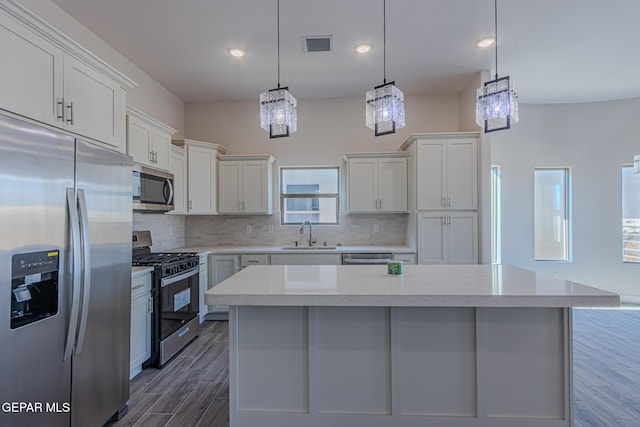 1798 Dana Gray St, El Paso, TX 79928 - kitchen featuring stainless steel appliances, tasteful backsplash, white cabinets, dark wood-style flooring, and recessed lighting