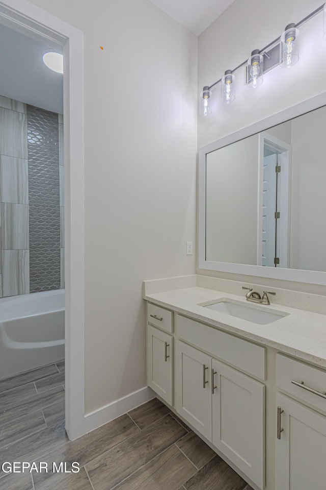 1798 Dana Gray St, El Paso, TX 79928 - full bathroom with vanity, wood tiled floors, and bathing tub / shower combination