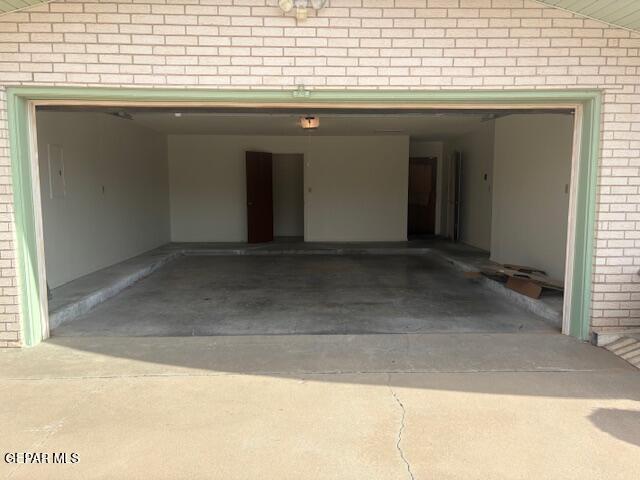10700 Janway Dr, El Paso, TX 79935 - garage with a garage door opener and driveway