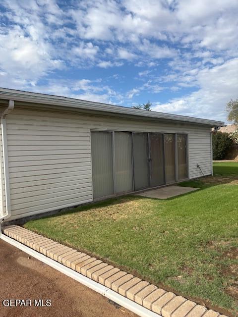 10700 Janway Dr, El Paso, TX 79935 - back of house with a yard