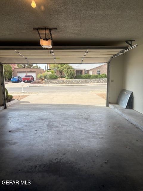 10700 Janway Dr, El Paso, TX 79935 - garage with a garage door opener