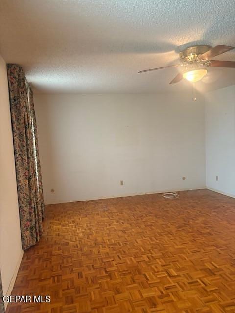 10700 Janway Dr, El Paso, TX 79935 - spare room with a textured ceiling and a ceiling fan