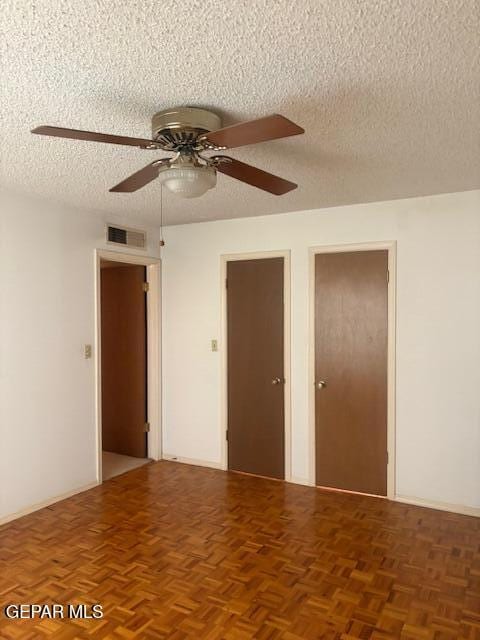 10700 Janway Dr, El Paso, TX 79935 - spare room with a textured ceiling and ceiling fan